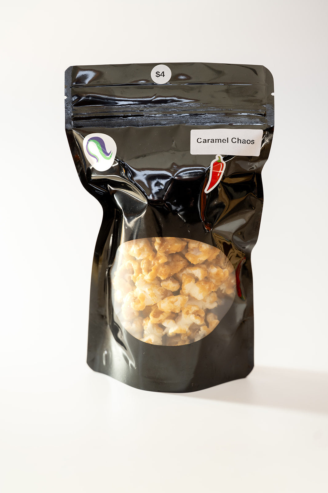 TBC Creations Caramel Chaos spicy popcorn small bag front view with chili pepper sticker